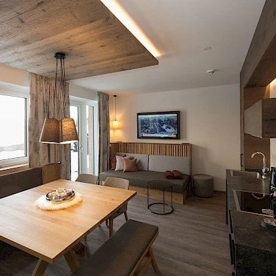 View of the holiday apartment for 6 - 8 people with dining and living area | Zirmhof Apartments in Saalbach